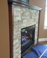 Custom built fireplace trim. <br><br>Solid maple, stained to match existing flooring and trim.