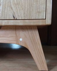 Detail of record cabinet base. <br><br>Doweled tenon joinery.