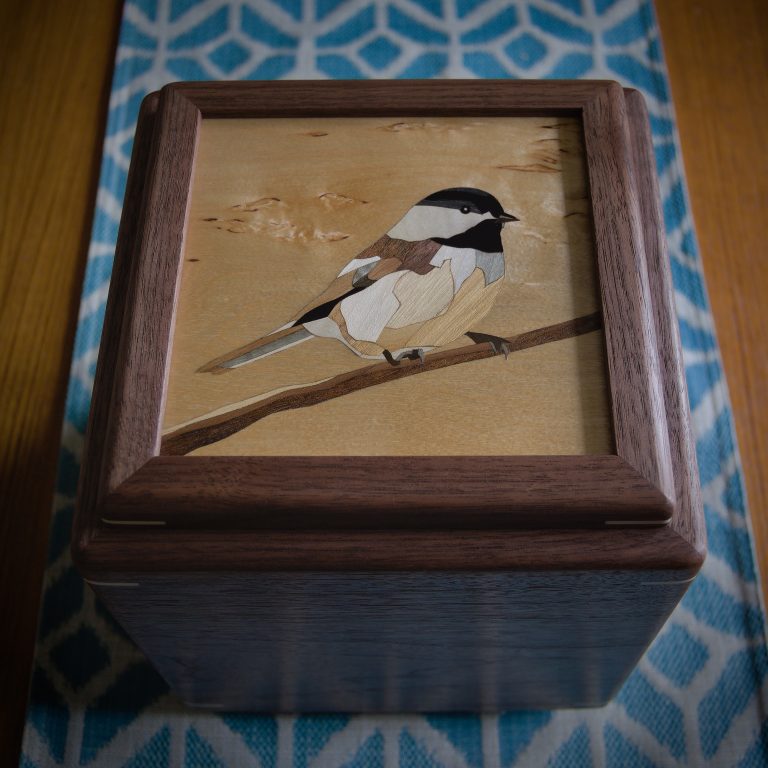 wooden urn with marquetry chickadee image on lid